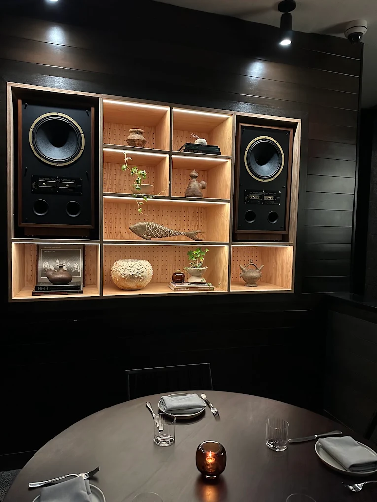 Dining beside the hi-fi wall at Darling